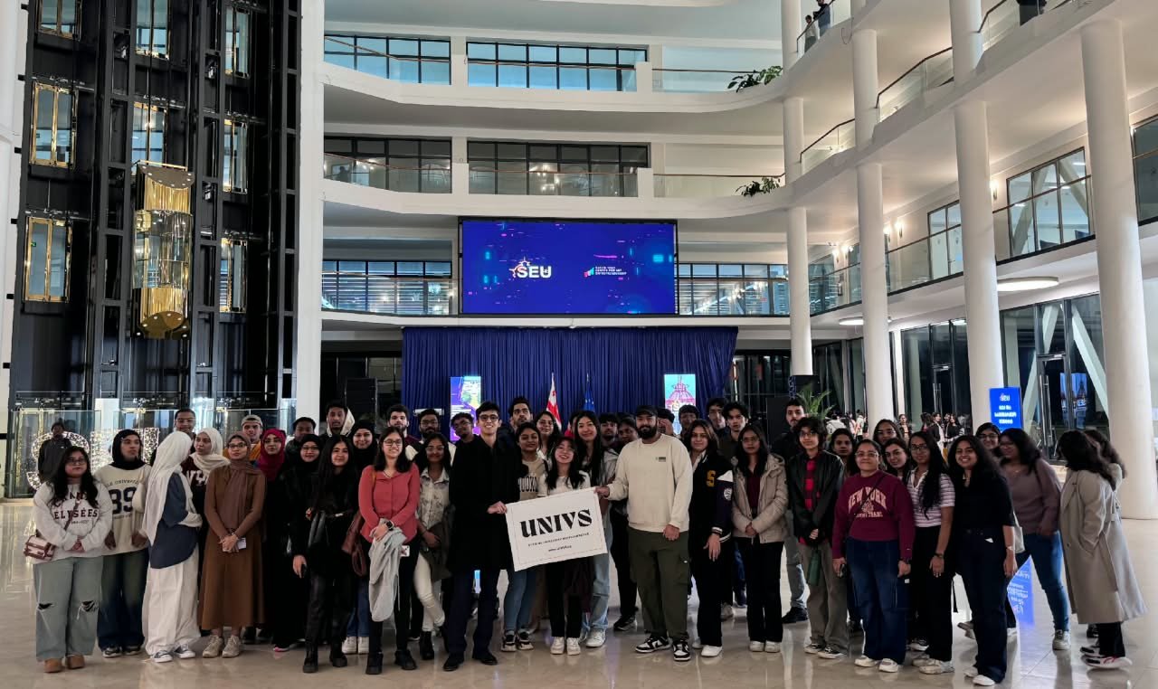The Univs community gathered in a university atrium